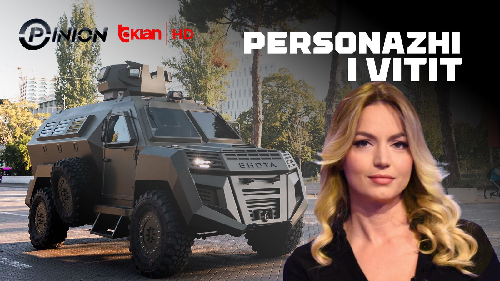 A woman standing in front of an armored vehicle, with the words "PERSONAZHI I VITIT" written in white text above her head. * The woman has blonde hair and is wearing a black shirt. * She is